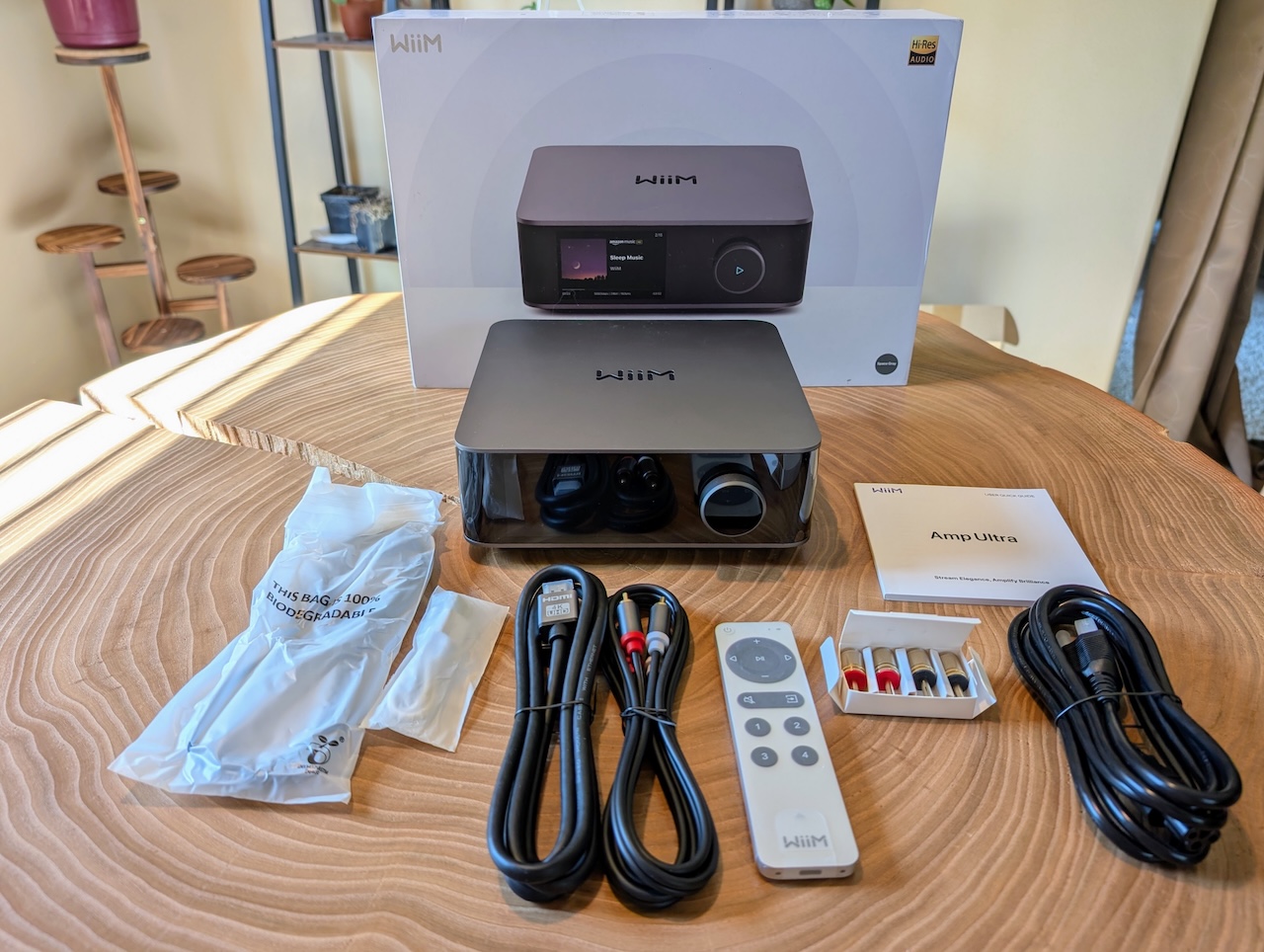 The WiiM Amp Ultra being unboxed on a table