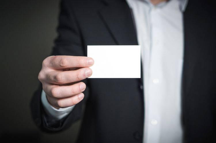 Man holding business card - www.pixabay.com