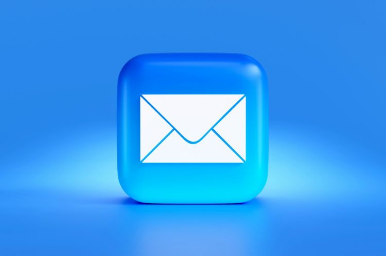 Closeup of a blue and white email icon.