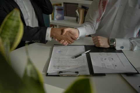 handshake over a contract https://unsplash.com/photos/two-people-shaking-hands-over-a-piece-of-paper-4mEyvORkbN0