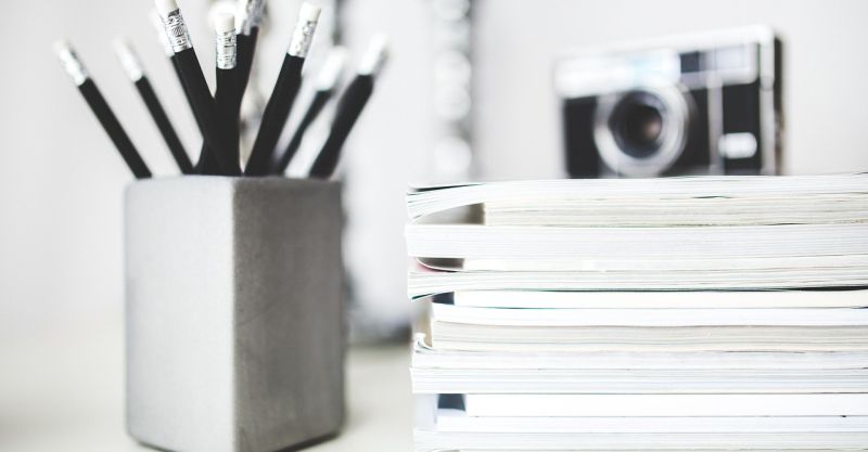 Image by Karolina Grabowska from Pixabay A bunch of pencil next to a stack of paper tablets