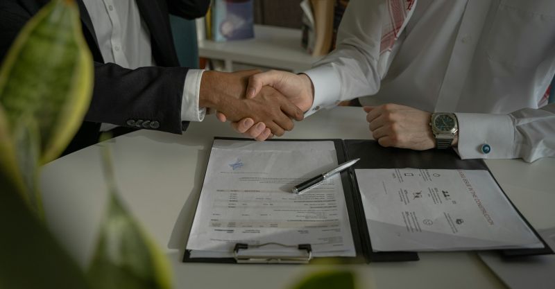 handshake over a contract https://unsplash.com/photos/two-people-shaking-hands-over-a-piece-of-paper-4mEyvORkbN0
