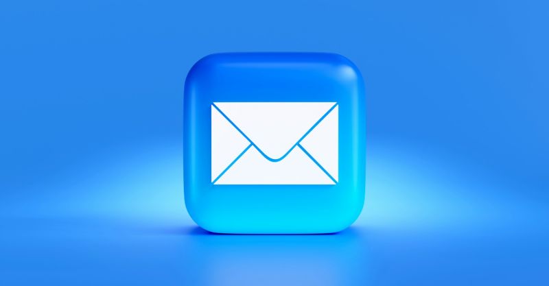 Closeup of a blue and white email icon.