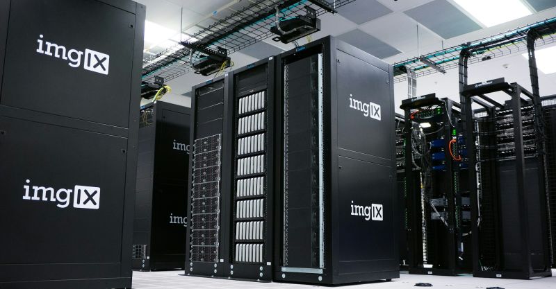 Rows of black server racks with white logos in a data center