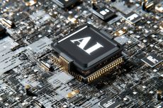 Closeup of a circuit board with "AI" printed on it