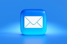 Closeup of a blue and white email icon.